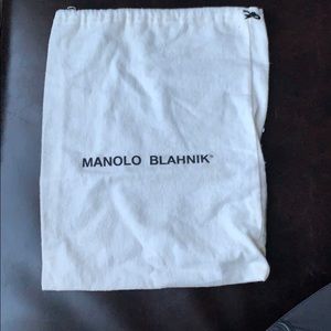 Manolo Blahnik ivory shoe bag.